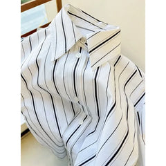 Black and White Striped Loose with A Wide Shoulder and Sleeve Top